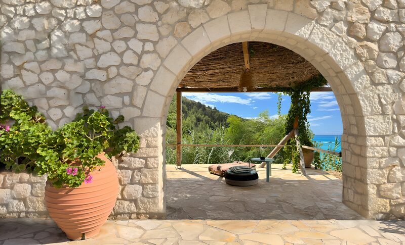 Serene Coastal View Through Stone Archway