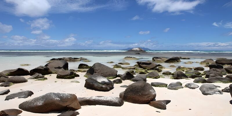 Tranquil Beach with Rocky Shoreline