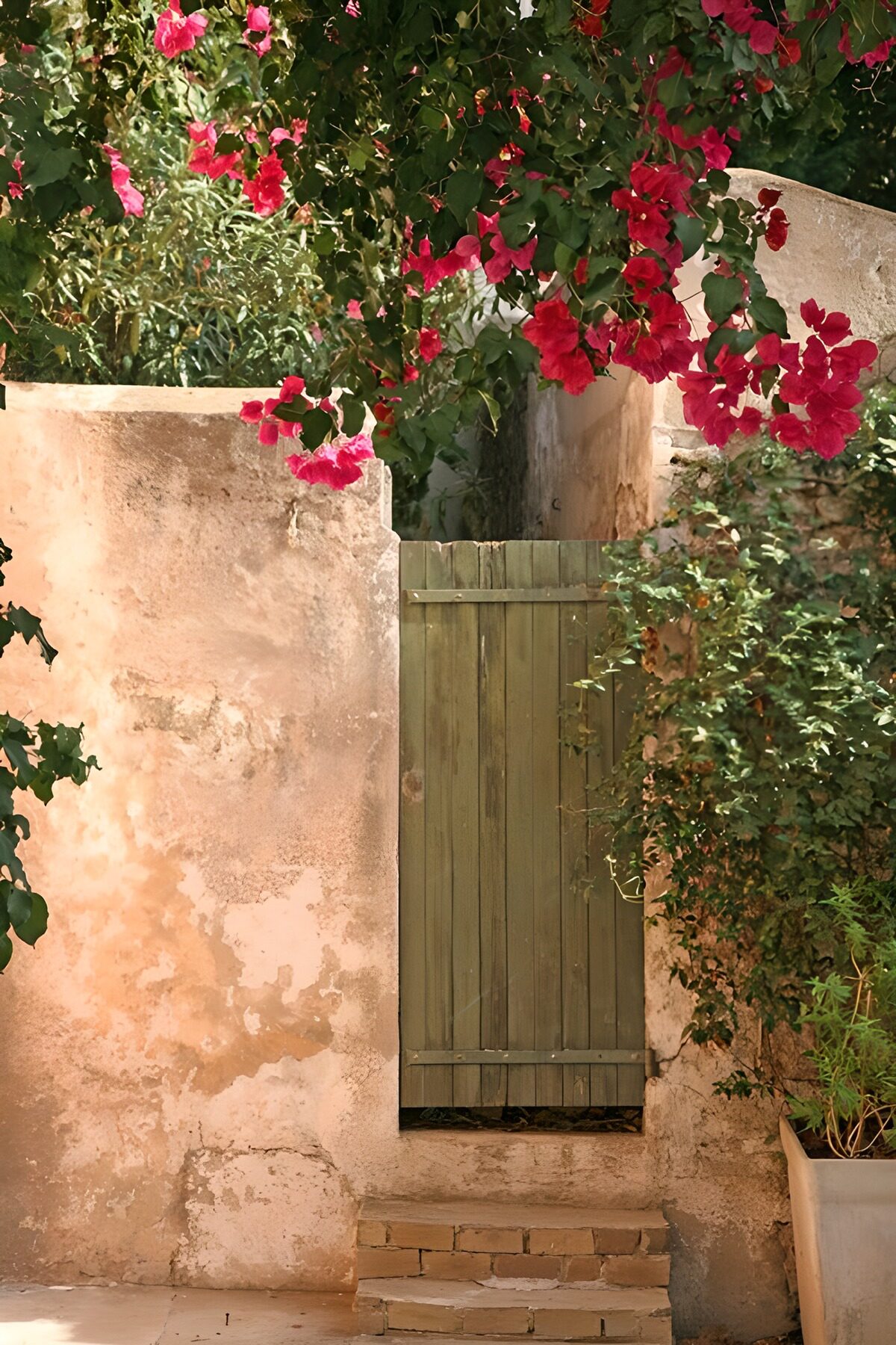 Charming Green Doorway Surrounded by Blooms
