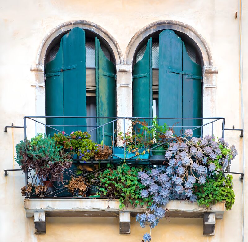 Charming Balcony with Green Shutters