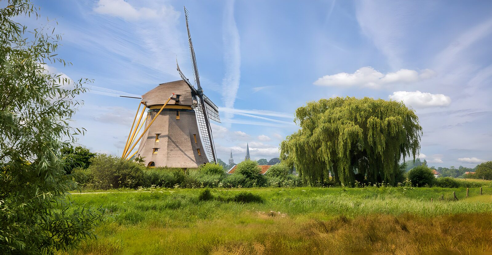 Traditional Windmill in Green Landscape