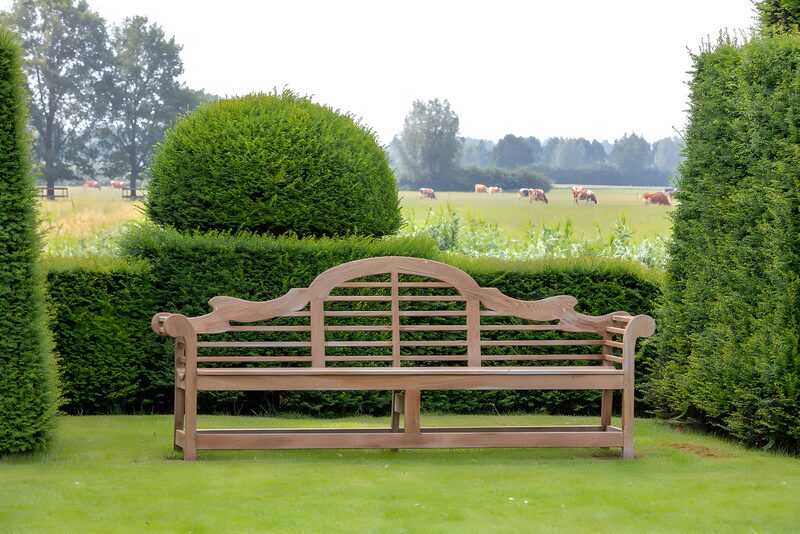 Serene Garden Bench Overlooking Pastures