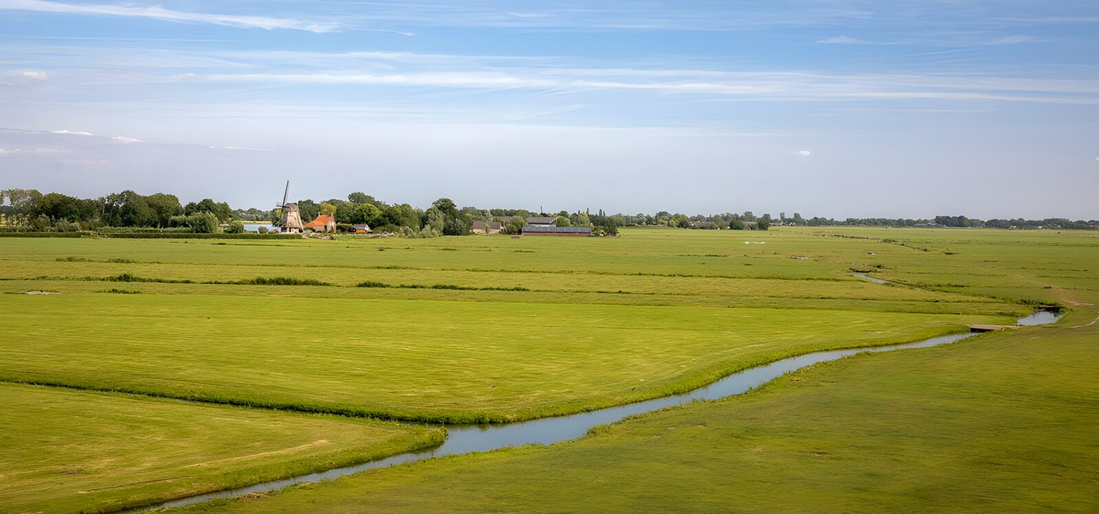 Serene Green Landscape with Farm