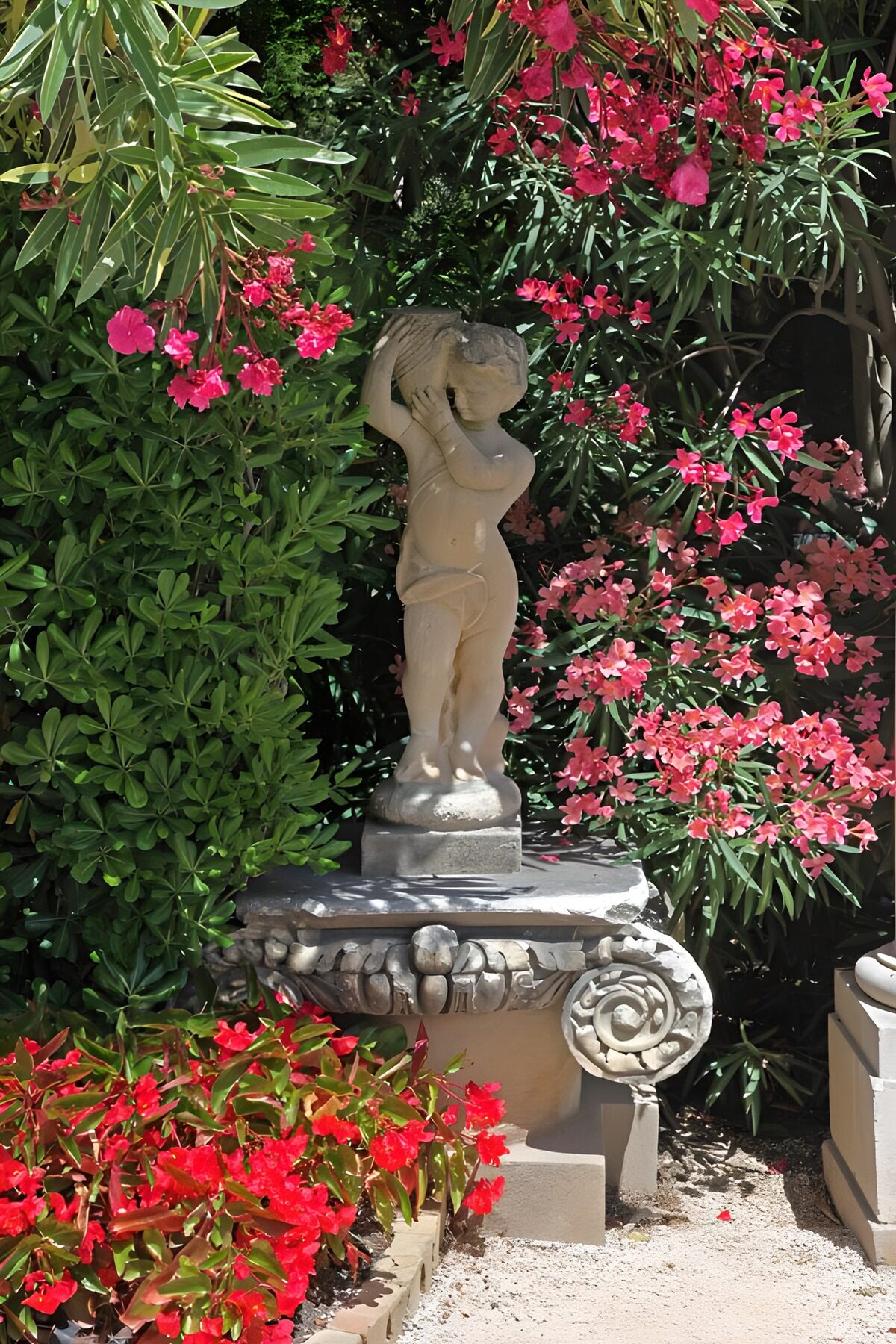 Serene Garden Statue Among Blossoms