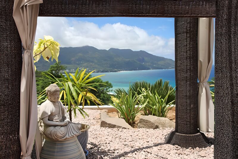 Serene Coastal Retreat with Buddha Statue
