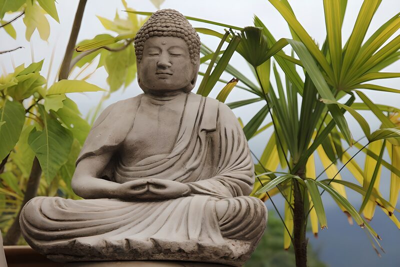 Tranquil Buddha Statue Surrounded by Nature
