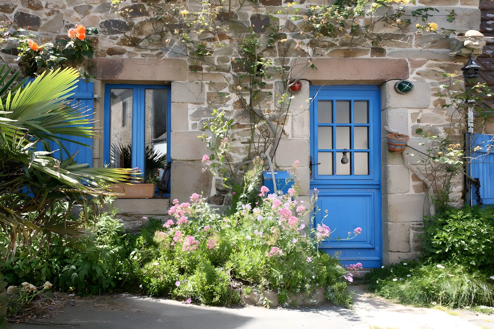 Charming Blue Doorway with Flowering Garden