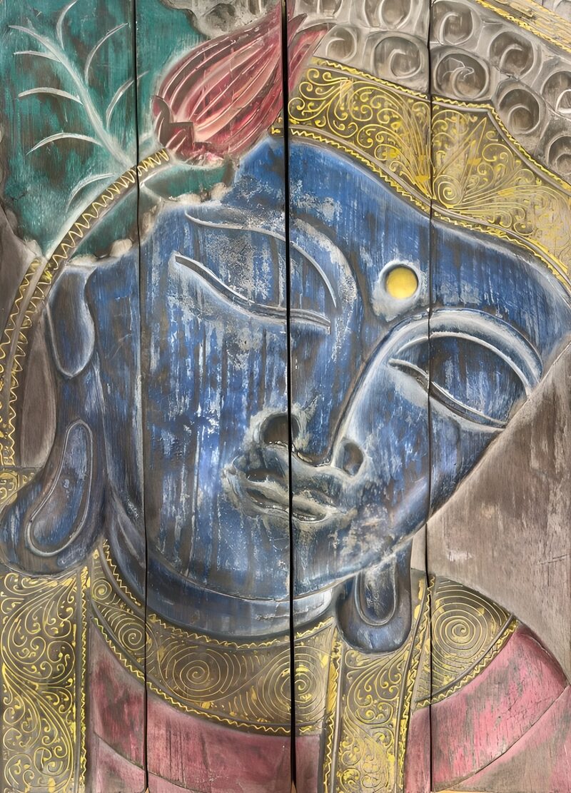 Vibrant Buddha Relief on Wood