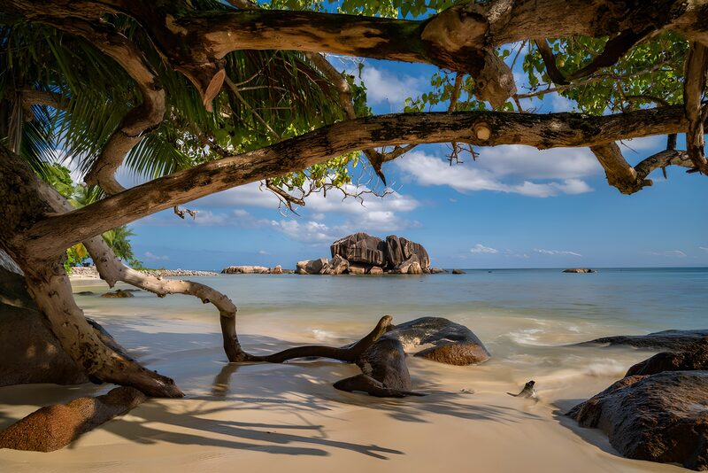 Serene Beach View with Rocky Outcrop